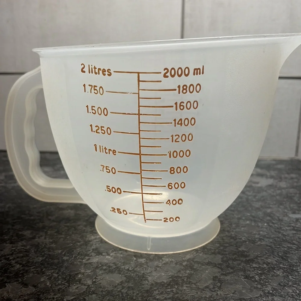 8 cup vintage measuring cup by Tupperware This one is old school. Exc condition
